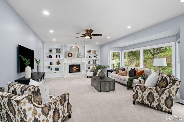 17527 Adams Way Ct, Wildwood, MO 63005 - carpeted living area featuring a ceiling fan, recessed lighting, a fireplace, and built in shelves