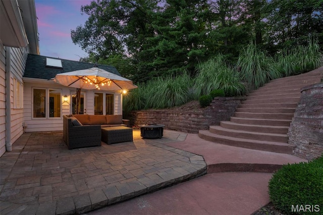 17527 Adams Way Ct, Wildwood, MO 63005 - patio terrace at dusk featuring a patio, outdoor lounge area, and stairway
