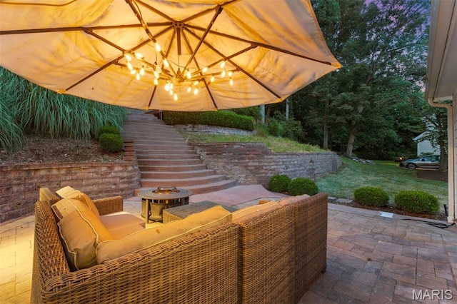 17527 Adams Way Ct, Wildwood, MO 63005 - view of patio / terrace with stairs and an outdoor living space with a fire pit