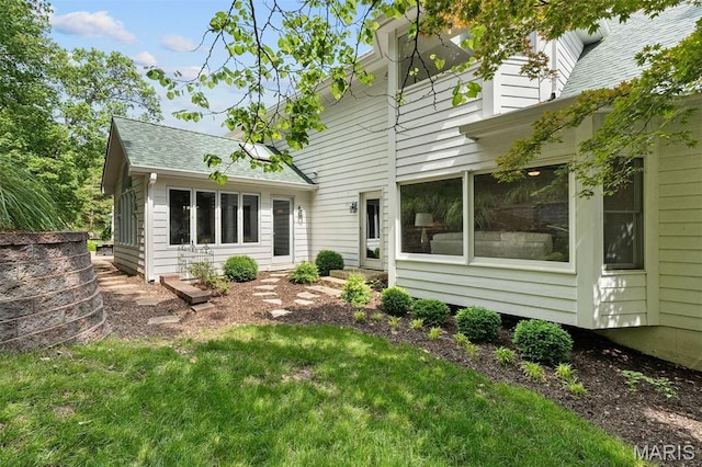17527 Adams Way Ct, Wildwood, MO 63005 - rear view of house featuring a shingled roof and a lawn