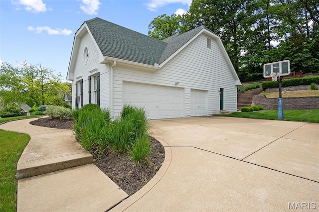 17527 Adams Way Ct, Wildwood, MO 63005 - view of property exterior featuring a shingled roof, a garage, and concrete driveway