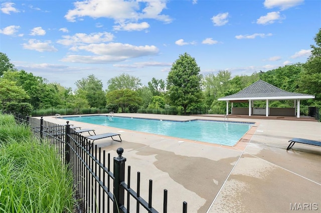 17527 Adams Way Ct, Wildwood, MO 63005 - community pool with a gazebo, a patio, and view of scattered trees