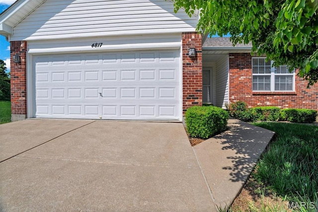 4817 Misty Wood Ct, Wentzville, MO 63385 - traditional-style home featuring brick siding, driveway, and an attached garage