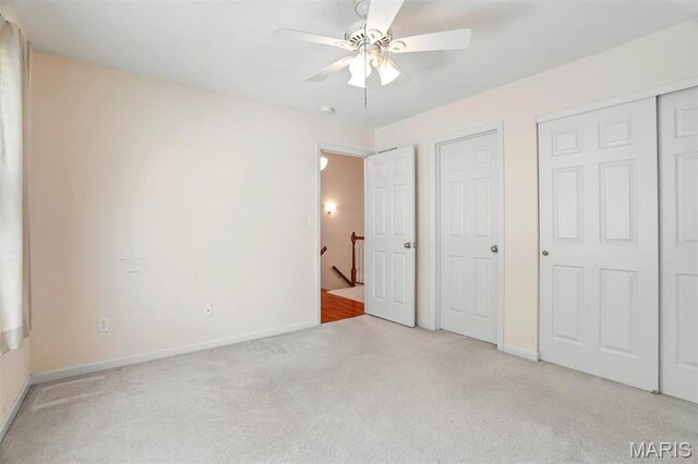 4817 Misty Wood Ct, Wentzville, MO 63385 - unfurnished bedroom with carpet floors, ceiling fan, and multiple closets