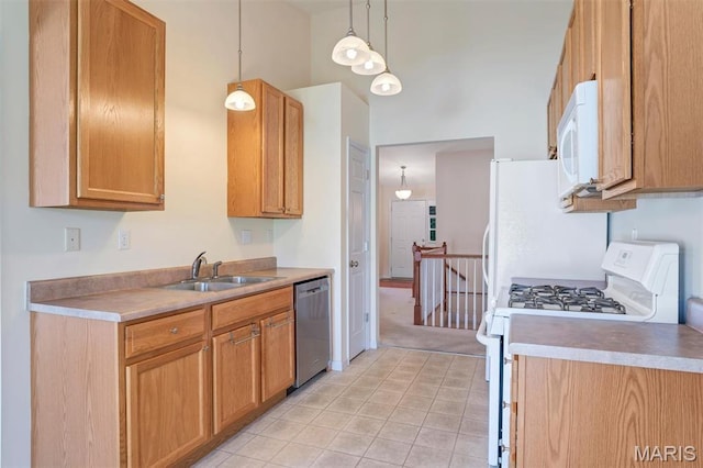 4817 Misty Wood Ct, Wentzville, MO 63385 - kitchen featuring white appliances, light countertops, light tile patterned flooring, and light colored carpet