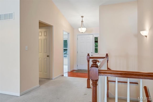 4817 Misty Wood Ct, Wentzville, MO 63385 - entrance foyer featuring carpet flooring and vaulted ceiling