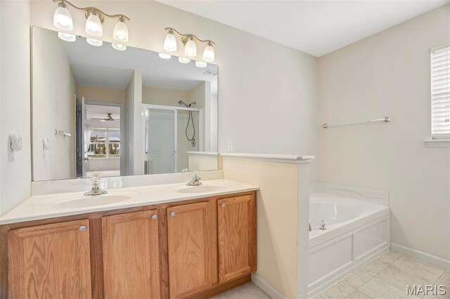 4817 Misty Wood Ct, Wentzville, MO 63385 - full bathroom featuring a shower stall, a garden tub, double vanity, and tile patterned floors