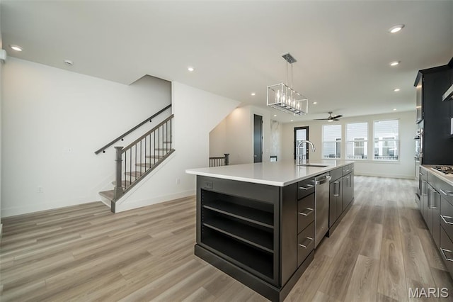 8935 E Gateway Hts Unit 94-808, Richmond Heights, MO 63144 - kitchen with open shelves, light wood-style floors, light countertops, a kitchen island with sink, and recessed lighting