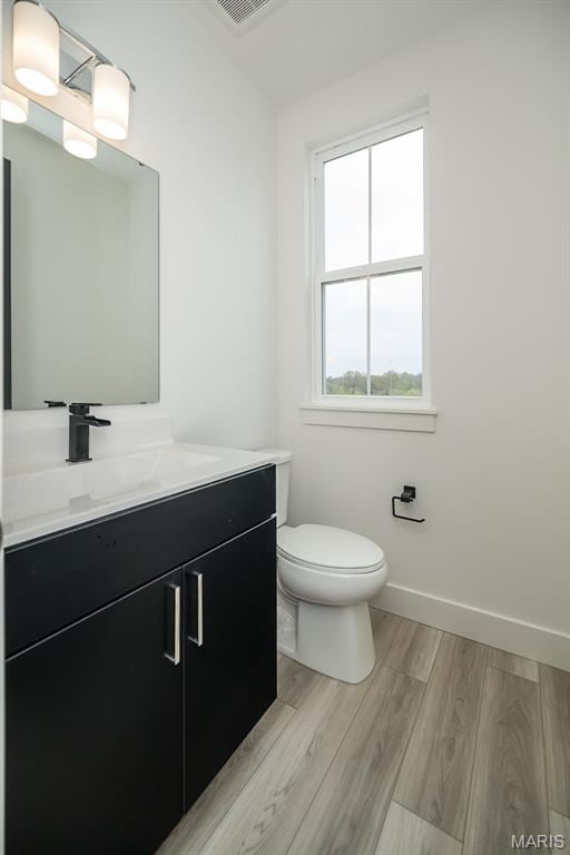 8935 E Gateway Hts Unit 94-808, Richmond Heights, MO 63144 - bathroom with vanity and wood finished floors