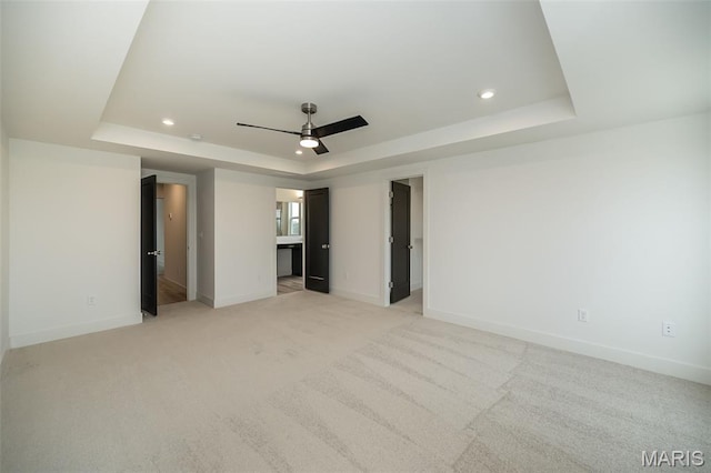 8935 E Gateway Hts Unit 94-808, Richmond Heights, MO 63144 - unfurnished bedroom featuring a raised ceiling, recessed lighting, light carpet, and a ceiling fan
