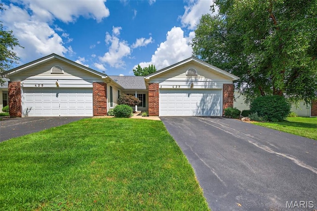 425 Charter Way Dr, Wildwood, MO 63040 - single story home featuring asphalt driveway, an attached garage, brick siding, and a front yard