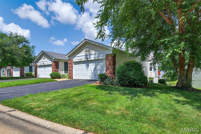 425 Charter Way Dr, Wildwood, MO 63040 - single story home with a garage, brick siding, a front lawn, and asphalt driveway