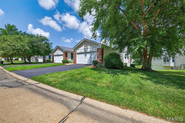 425 Charter Way Dr, Wildwood, MO 63040 - ranch-style home with a front lawn, a garage, brick siding, and asphalt driveway