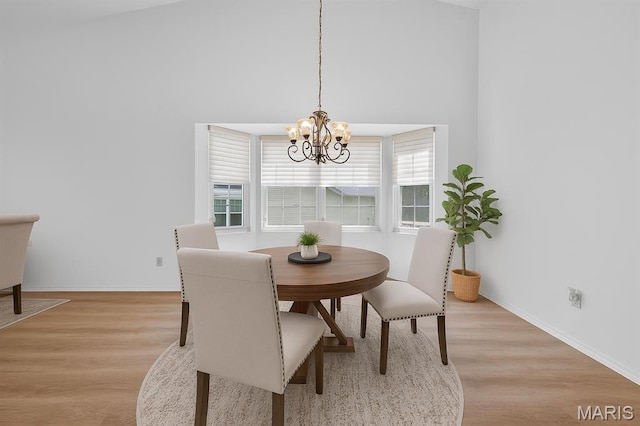 425 Charter Way Dr, Wildwood, MO 63040 - dining area with light wood finished floors and a chandelier
