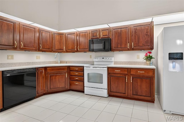 425 Charter Way Dr, Wildwood, MO 63040 - kitchen with black appliances, light countertops, and brown cabinets