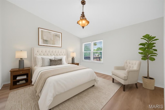 425 Charter Way Dr, Wildwood, MO 63040 - bedroom with wood finished floors and lofted ceiling