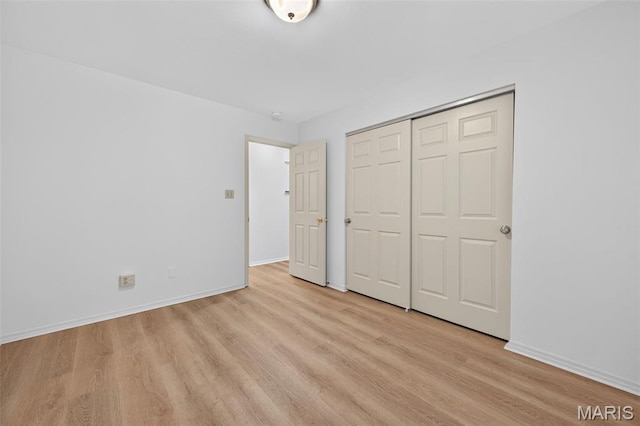 425 Charter Way Dr, Wildwood, MO 63040 - unfurnished bedroom featuring light wood finished floors and a closet