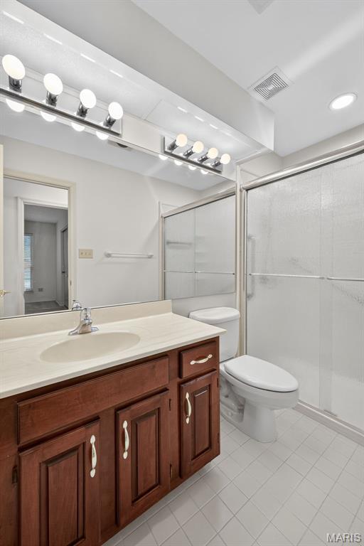 425 Charter Way Dr, Wildwood, MO 63040 - full bathroom featuring vanity, tile patterned floors, and a shower stall