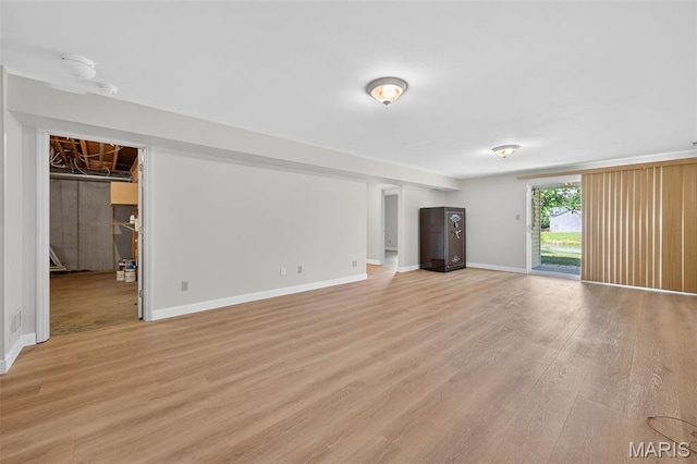 425 Charter Way Dr, Wildwood, MO 63040 - unfurnished living room with light wood-type flooring and baseboards