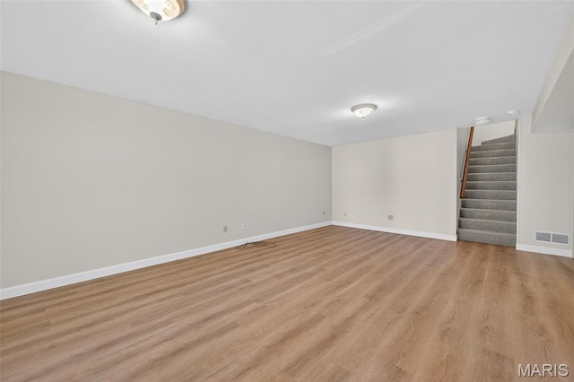 425 Charter Way Dr, Wildwood, MO 63040 - finished basement with stairway and light wood-style flooring