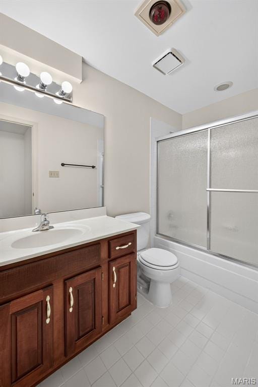 425 Charter Way Dr, Wildwood, MO 63040 - full bathroom featuring vanity, tile patterned flooring, and bath / shower combo with glass door