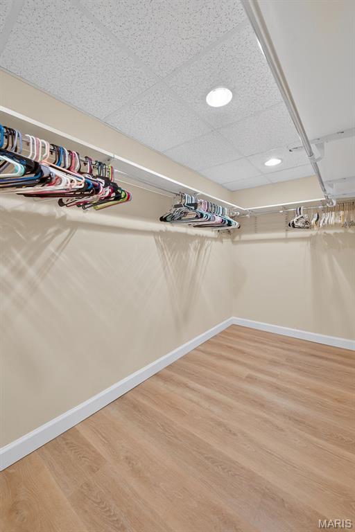 425 Charter Way Dr, Wildwood, MO 63040 - spacious closet featuring wood finished floors