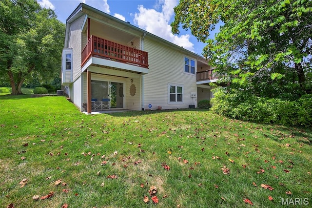 425 Charter Way Dr, Wildwood, MO 63040 - rear view of property with a lawn and a balcony