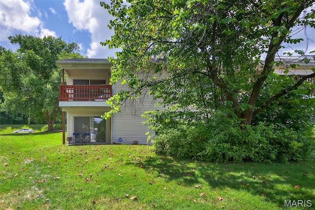 425 Charter Way Dr, Wildwood, MO 63040 - back of house with a balcony and a lawn