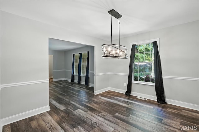 20 Hiddenbrook Dr, Black Jack, MO 63033 - unfurnished dining area with a chandelier and dark wood finished floors