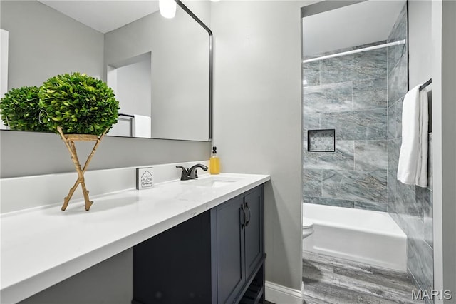 20 Hiddenbrook Dr, Black Jack, MO 63033 - bathroom featuring vanity, wood finished floors, and bathtub / shower combination
