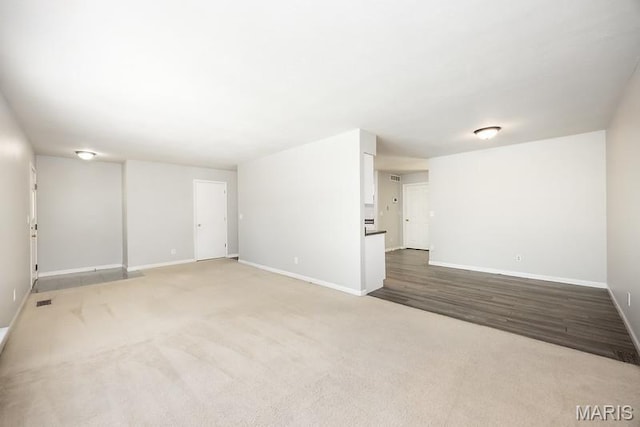 2313 College, Belleville, IL 62221 - unfurnished room featuring baseboards and carpet floors