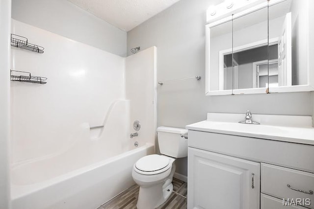 2313 College, Belleville, IL 62221 - full bath with vanity, shower / bathtub combination, and wood finished floors