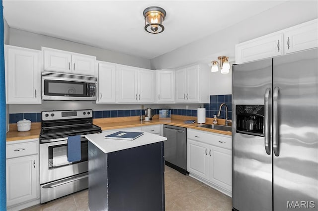 420 Echo Hill Dr, Ballwin, MO 63021 - kitchen featuring appliances with stainless steel finishes, light countertops, and white cabinets