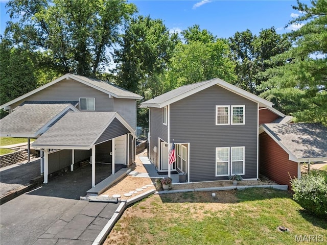 420 Echo Hill Dr, Ballwin, MO 63021 - rear view of property featuring a carport, a garage, a yard, and asphalt driveway