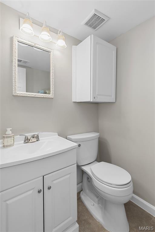 420 Echo Hill Dr, Ballwin, MO 63021 - half bathroom featuring tile patterned flooring and vanity