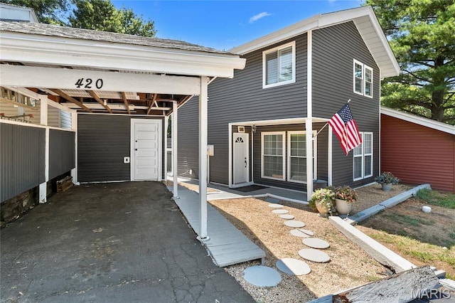 420 Echo Hill Dr, Ballwin, MO 63021 - view of front facade featuring a carport and asphalt driveway