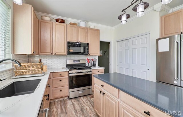 20 Airfield Crossing Court, Lake St Louis, MO 63367 - kitchen featuring stainless steel appliances, light brown cabinetry, crown molding, light wood-type flooring, and decorative backsplash