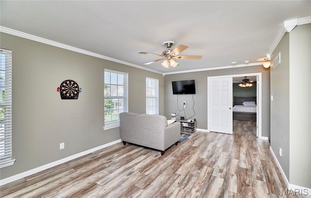 20 Airfield Crossing Court, Lake St Louis, MO 63367 - living area featuring a ceiling fan, crown molding, and light wood-type flooring