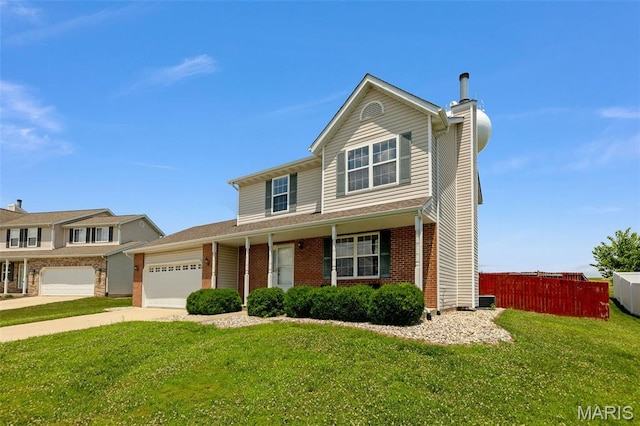 922 Benjamin Dr, Ofallon, IL 62269 - view of front facade featuring a chimney, an attached garage, brick siding, and driveway