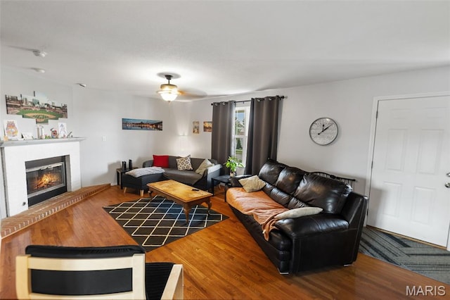 922 Benjamin Dr, Ofallon, IL 62269 - living area featuring a glass covered fireplace, ceiling fan, and wood finished floors