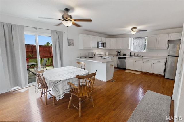 922 Benjamin Dr, Ofallon, IL 62269 - dining space featuring a ceiling fan, dark wood finished floors, and plenty of natural light