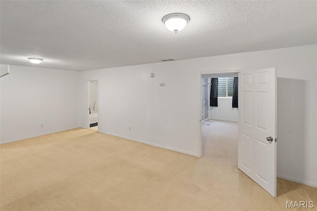 922 Benjamin Dr, Ofallon, IL 62269 - spare room with a textured ceiling and light carpet