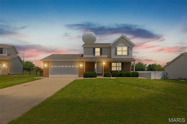 922 Benjamin Dr, Ofallon, IL 62269 - traditional-style home with an attached garage, driveway, covered porch, and brick siding