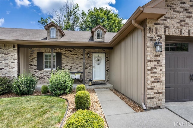 101 Archview Dr, Shiloh, IL 62221 - doorway to property with a garage, a porch, and brick siding