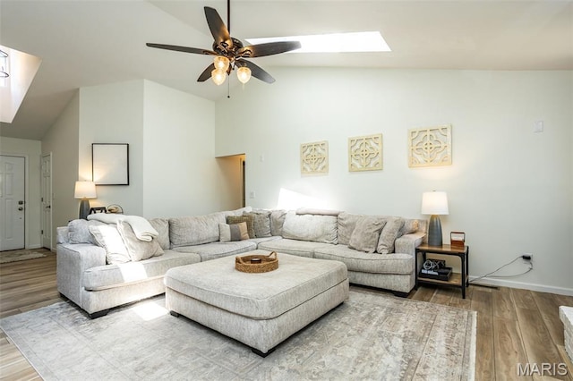 101 Archview Dr, Shiloh, IL 62221 - living room featuring a skylight, ceiling fan, wood finished floors, and high vaulted ceiling