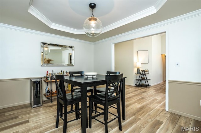 101 Archview Dr, Shiloh, IL 62221 - dining area featuring wine cooler, light wood-style flooring, ornamental molding, and a raised ceiling
