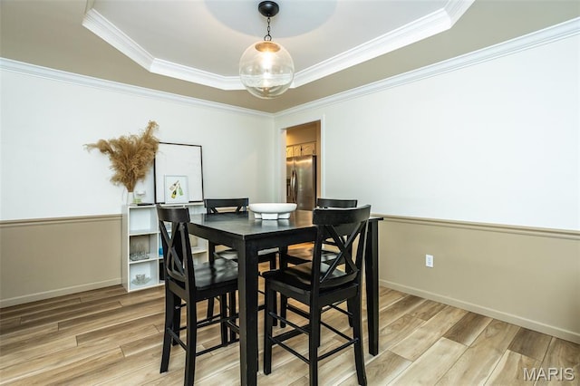 101 Archview Dr, Shiloh, IL 62221 - dining space with light wood-style floors, crown molding, and a tray ceiling