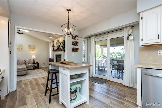 101 Archview Dr, Shiloh, IL 62221 - kitchen with stainless steel dishwasher, white cabinetry, light wood-type flooring, open floor plan, and open shelves