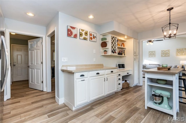 101 Archview Dr, Shiloh, IL 62221 - kitchen with open shelves, light wood-style flooring, white cabinetry, light countertops, and recessed lighting