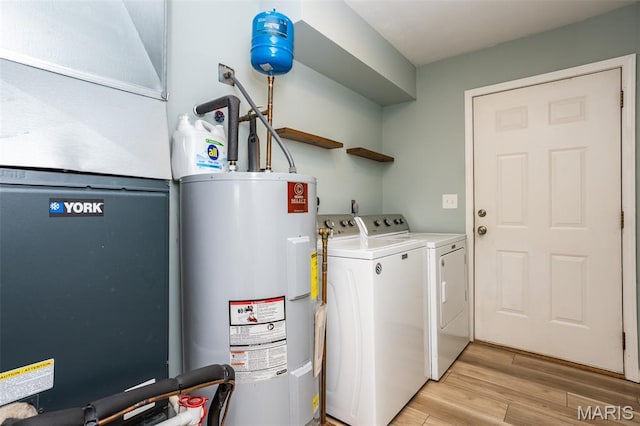 101 Archview Dr, Shiloh, IL 62221 - laundry room with electric water heater, washer and dryer, light wood-type flooring, and heating unit